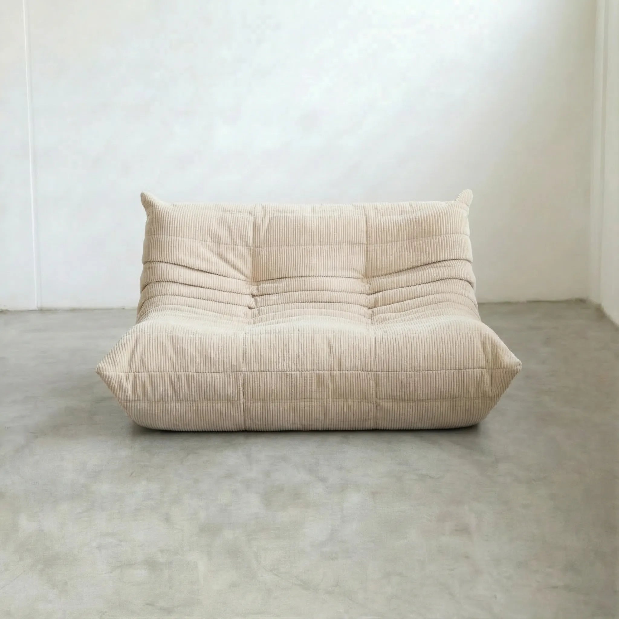 Togo 2-seater Sofa dupe in cream corduroy with Togo silhouette designed by michael ducaroy for ligne roset – custom-made by vibehaus