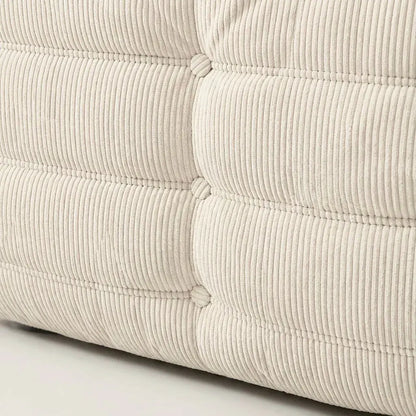 Close up of the Togo 2-seater Sofa dupe in cream corduroy with Togo silhouette designed by michael ducaroy for ligne roset – custom-made by vibehaus