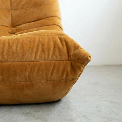 Close up of the Togo 2-seater Sofa dupe in velvet mustard by vibehaus
