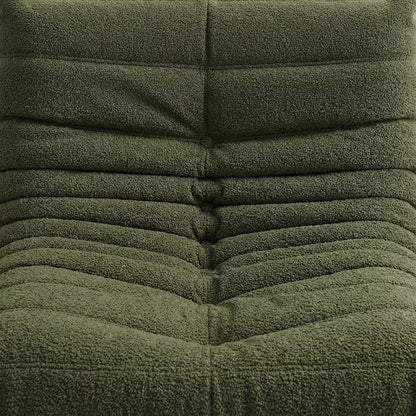 Replica of the green boucle Togo-chair by michael ducaroy–  low, frameless design with plush channel tufting