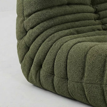 Close-up of the dupe green boucle togo fireside chair lounger – soft, dirt-resistant fabric with comfortable texture