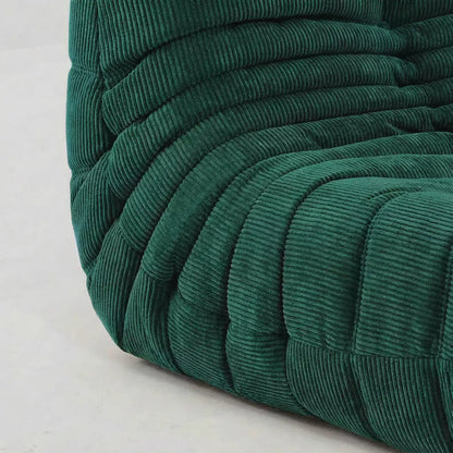 Close up sofa chair as dupe in corduroy green – plush high-density sponge filling for ergonomic comfort