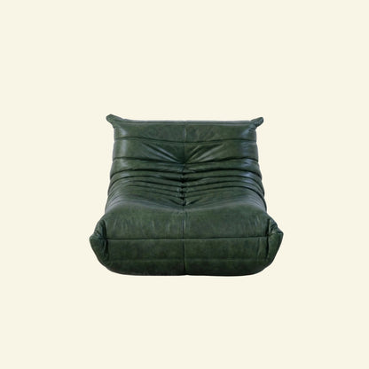 Togo Chair Dupe in green real oil wax leather on a beige background by vibehaus