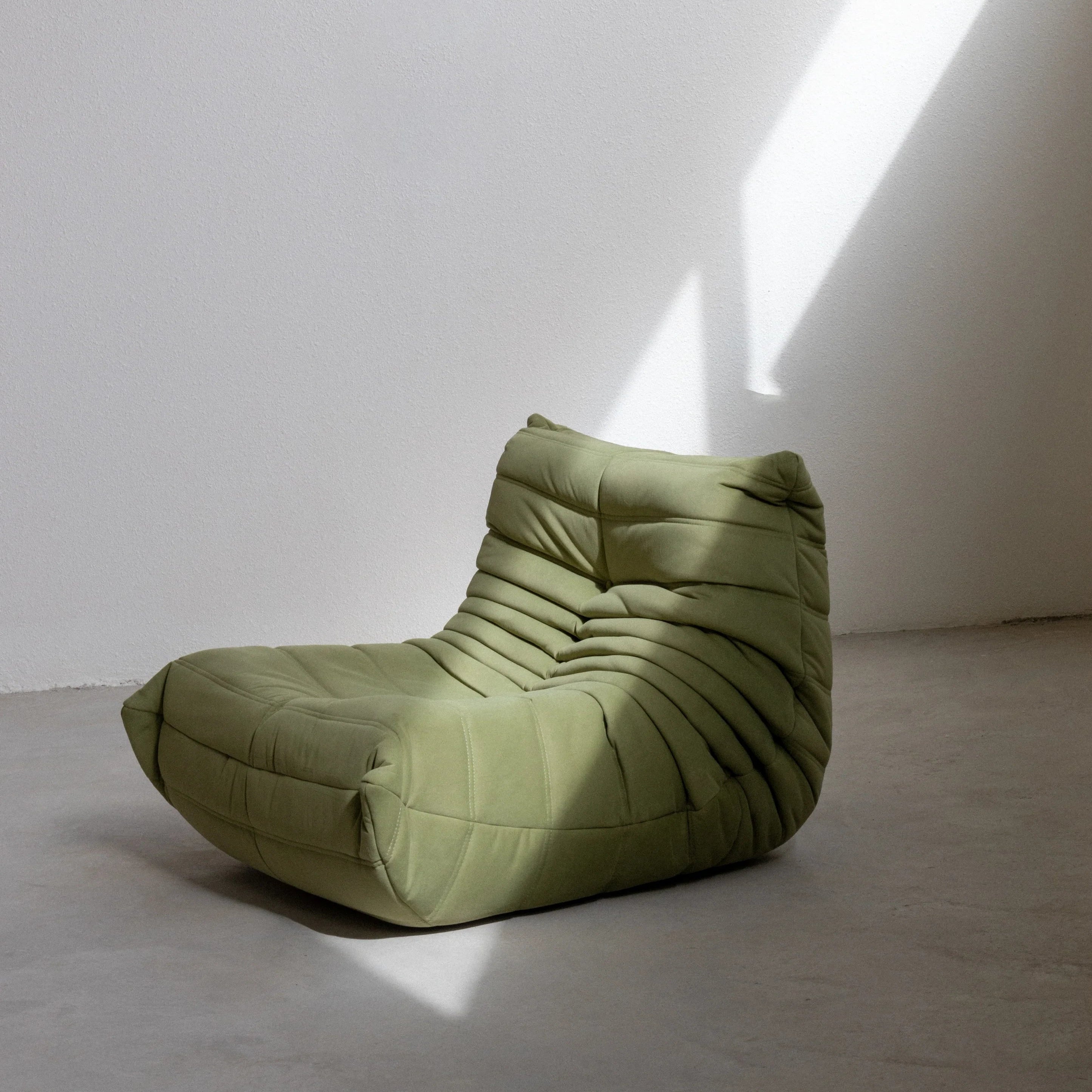 Togo Chair Dupe in green velvet photographed from the side by vibehaus
