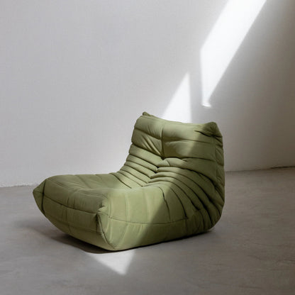Togo Chair Dupe in green velvet photographed from the side by vibehaus