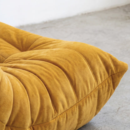 Close up of the velvet suede fabric of the togo chair dupe in yellow by vibehaus