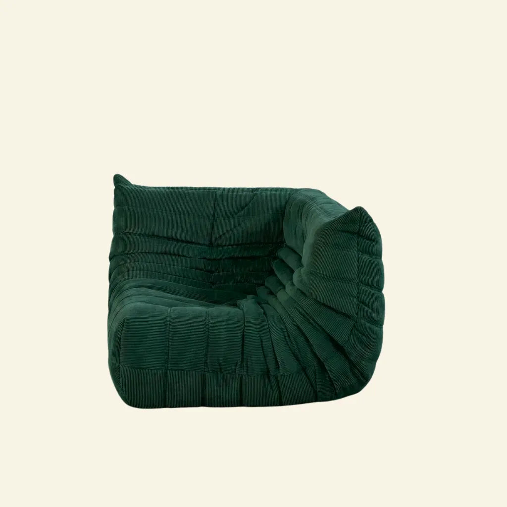 Togo Sofa Corner Dupe in dark green corduroy on a beige background