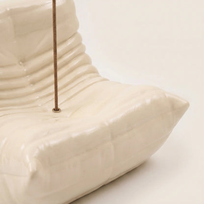 Close up of the togo incense holder in cream beige resin