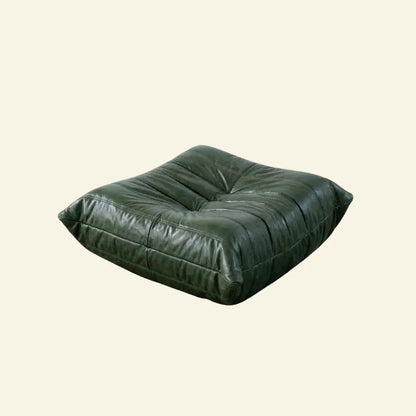 Green togo leather ottoman dupe on a beige background