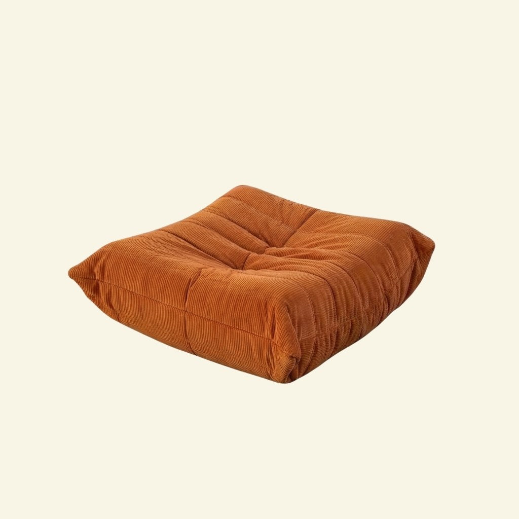 Togo Ottoman Dupe in orange Corduroy on beige background