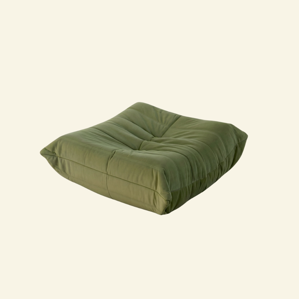 Togo Ottoman Dupe in green velvet on beige background
