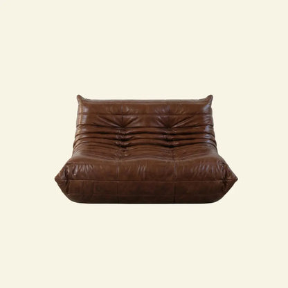 Brown togo sofa dupe in leather on a light beige background