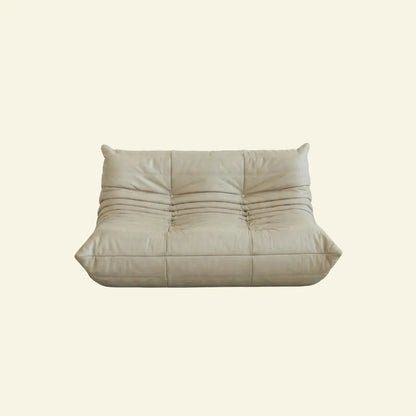 Cream togo sofa dupe in leather on a light beige background