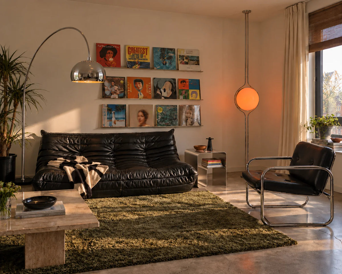 Living room with the Aura arc floor lamp, Zuru floor to ceiling lamp and curved stainless steel side table