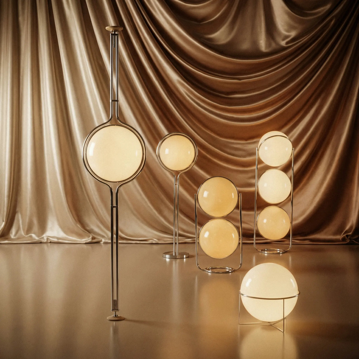 Zuru floor-to-ceiling lamps with glowing globes in front of gold curtains.