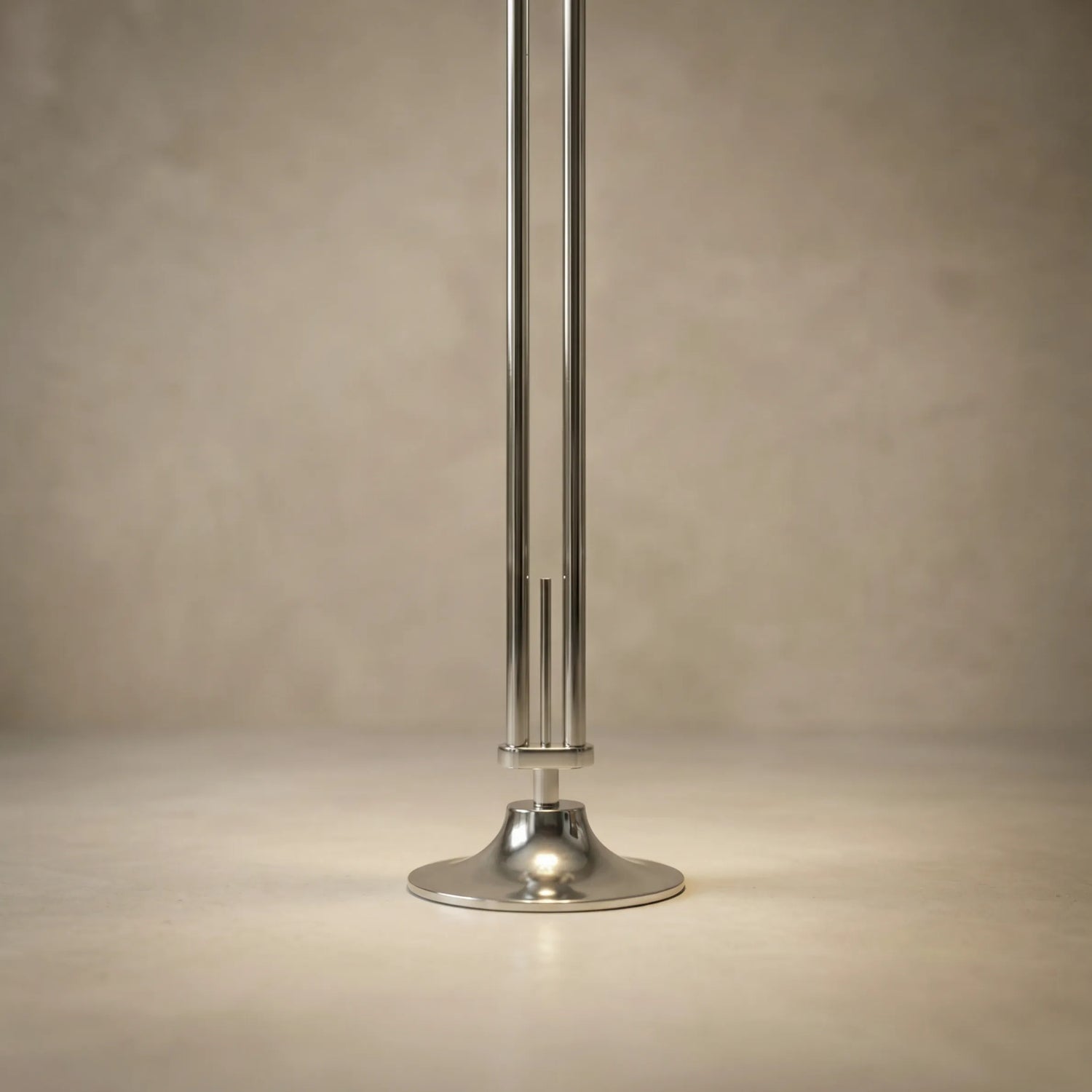 zuru floor to ceiling lamp close-up of chrome pole and round base on neutral background
