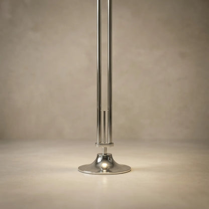 zuru floor to ceiling lamp close-up of chrome pole and round base on neutral background